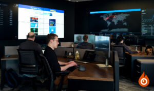 Security analysts in a 24/7 operations center monitoring alerts for SMB environments